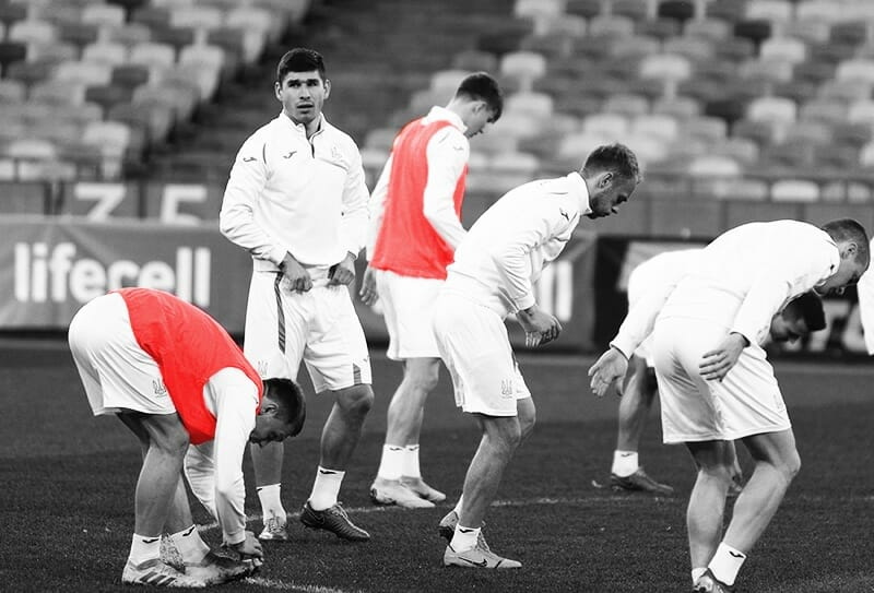 Players warming up on pitch