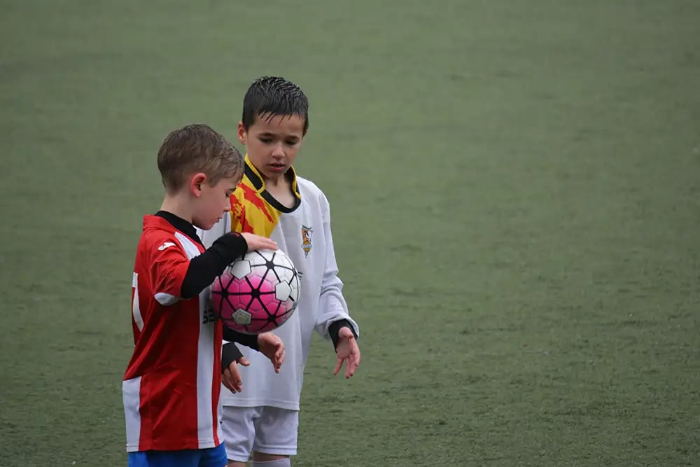 children playing football