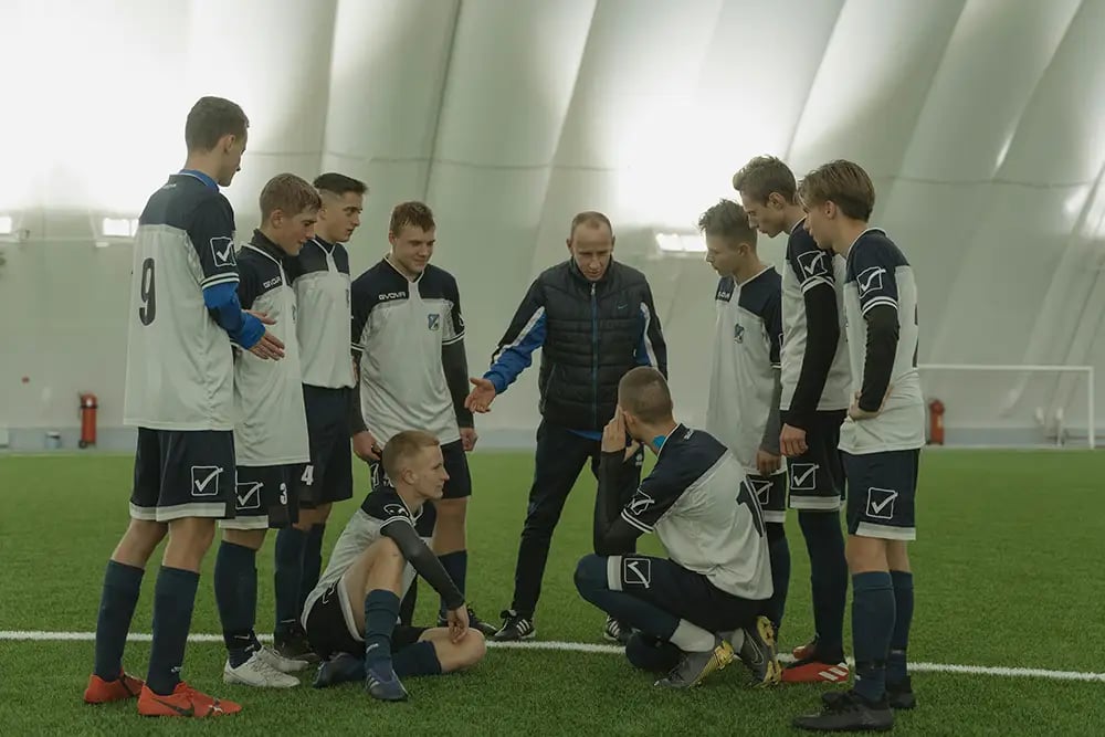 Mens Football Team Training talking to Coach