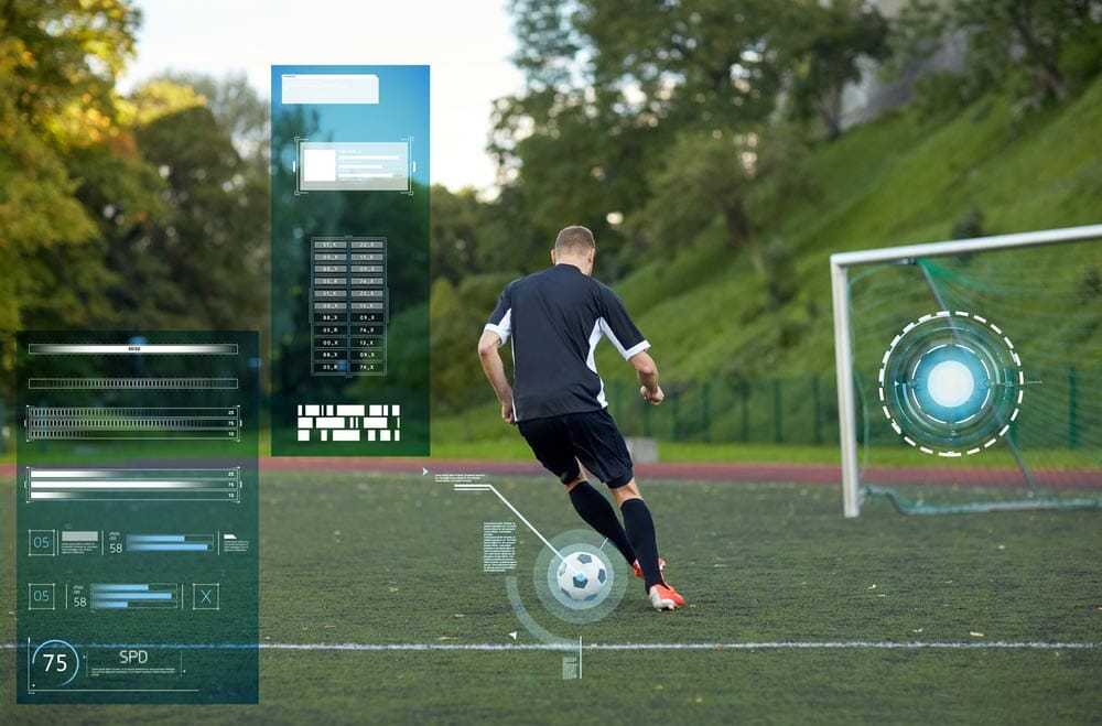 sport, football training and people - soccer player playing with ball on field