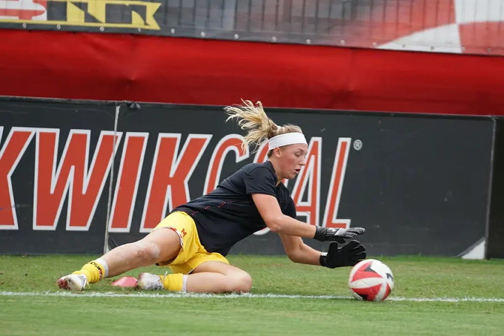 Goalkeeper warming up diving save training