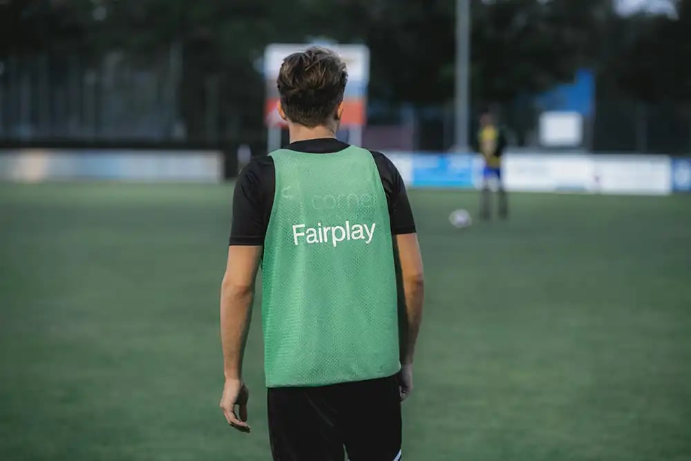 Soccer-Player-in-Training-wearing-a-Green-bib