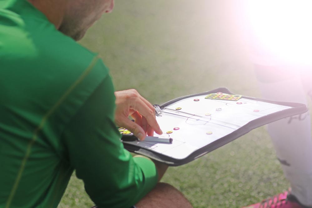 Close up of a football / soccer magnetic coach board with game plan (on a bench at the soccer field)
