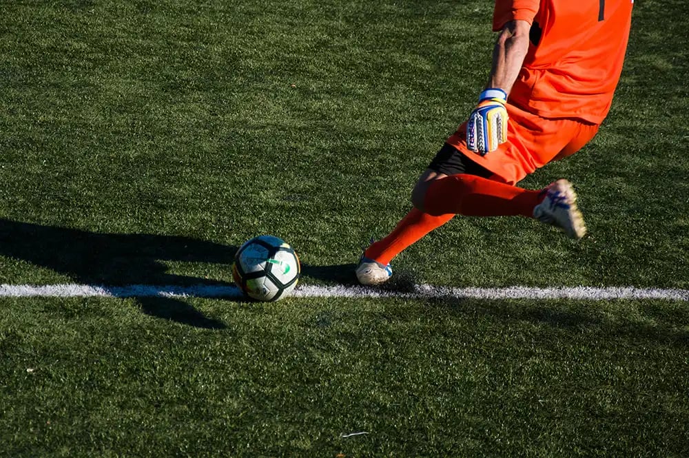 Goal keeper kicking ball