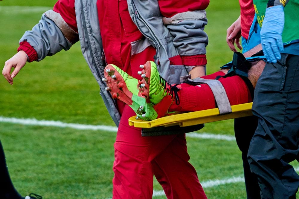doctors take away from the field injured player