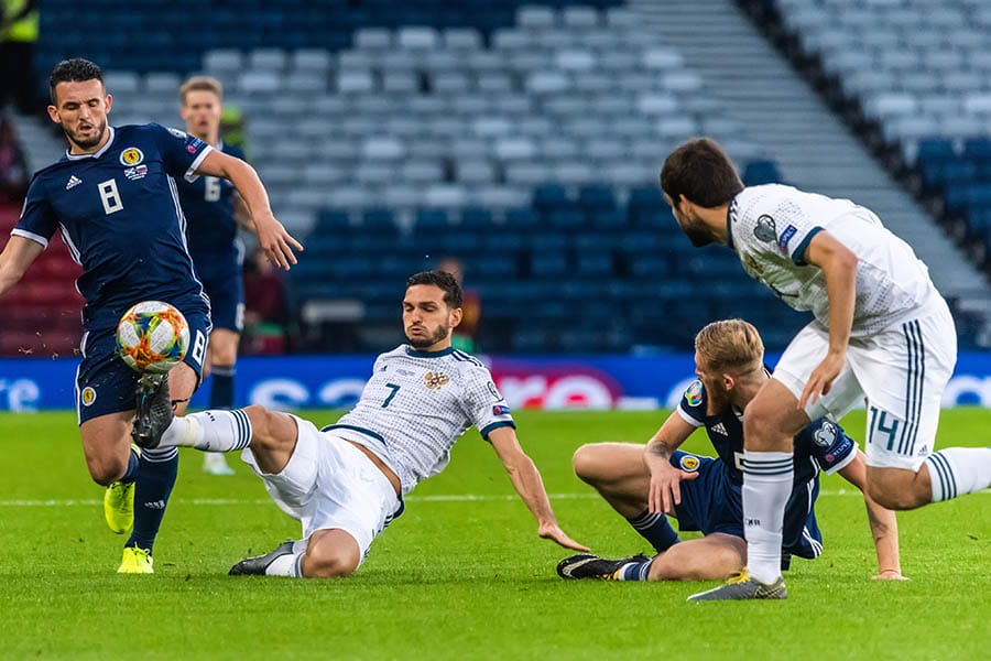 Glasgow, United Kingdom â€“ September 6, 2019. Players Magomed Ozdoyev, Georgi Dzhikiya, John McGinn and Oliver McBurnie during UEFA Euro 2020 qualification match Scotland vs Russia