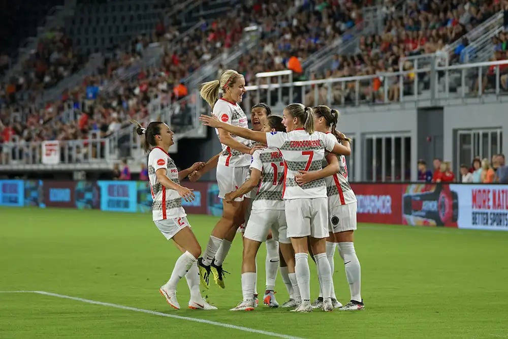 Womens-Soccer-Team-Celebrating-a-Goal