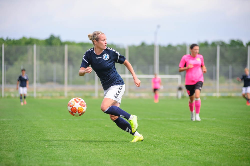 KHARKIV, UKRAINE - July 31, 2020: Woman football match Zhilstroi-1 vs. Voshod. There is no lockdown. Public events are allowed. Europe match of football during CV pandemic.