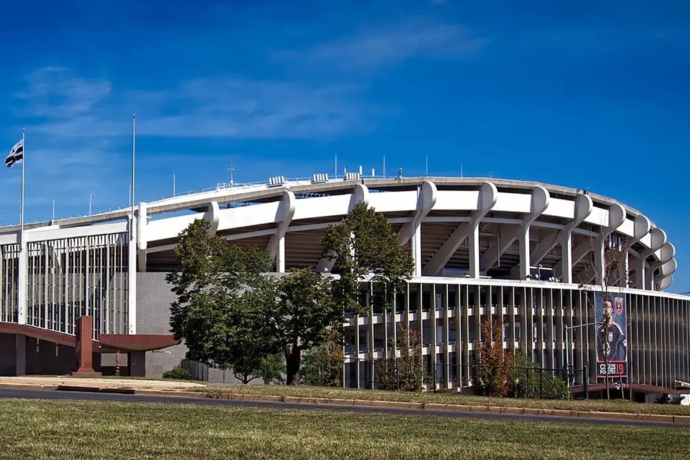 White Concrete Building on Green Grass Field during Daytime