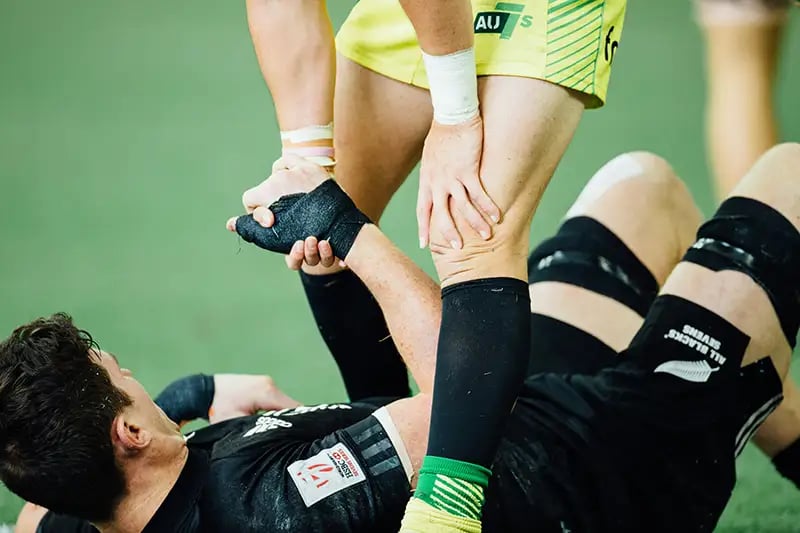 Soccer Player Lifting opponent off the floor