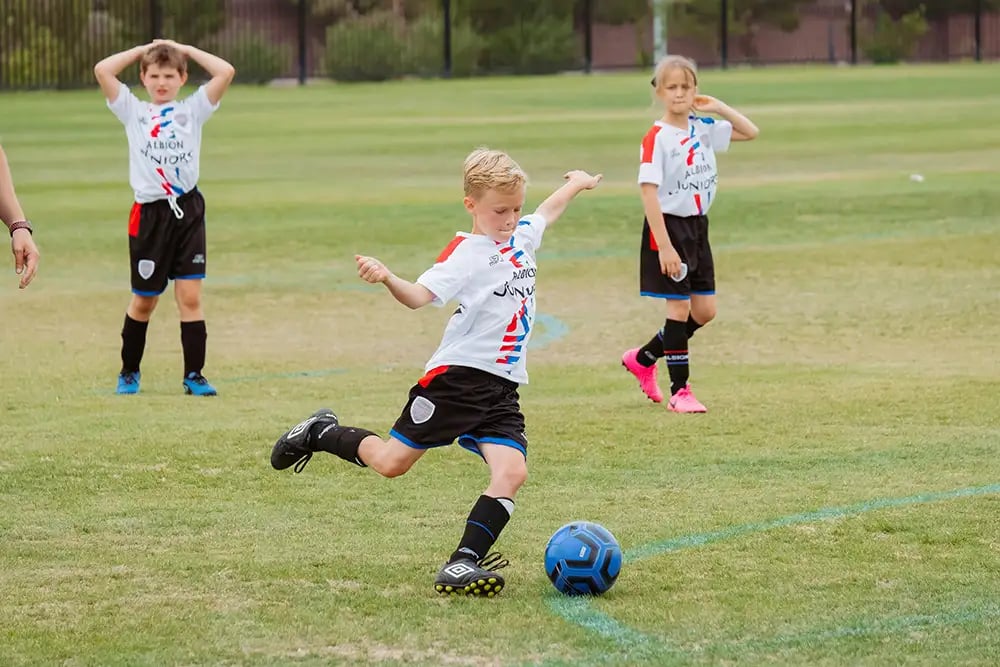 children playing football
