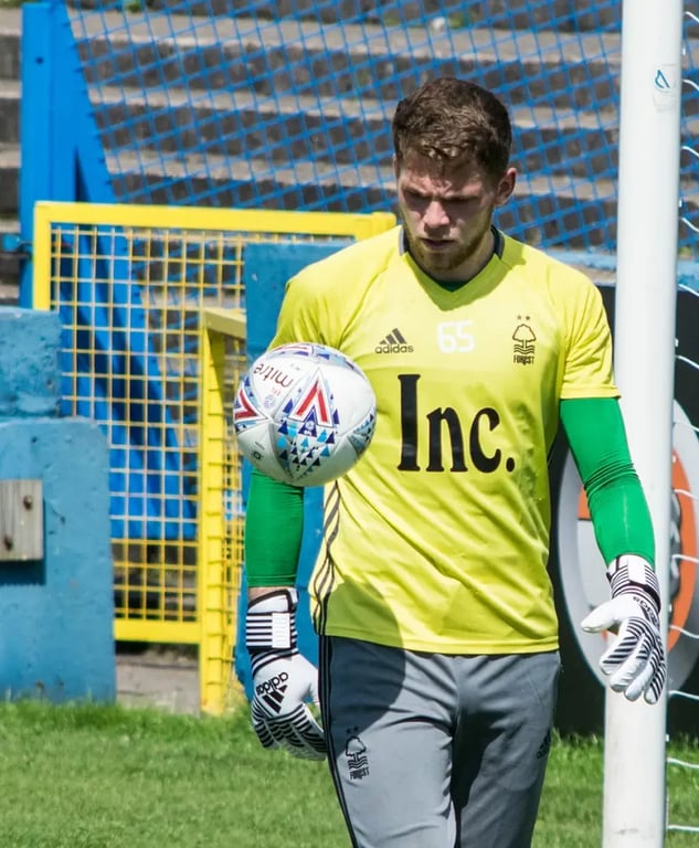 Goalkeeper in yellow shirt