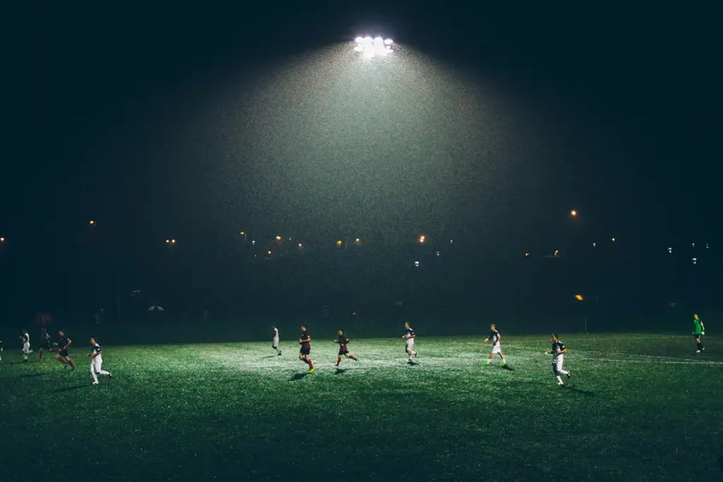 Soccer Match at Night Under a Floodlight