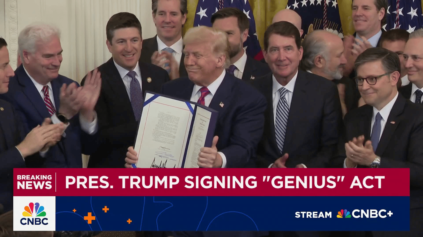 President Donald Trump signing the GENIUS Act, a U.S. stablecoin law that shaped the debate over issuer interest and exchange-paid stablecoin rewards.