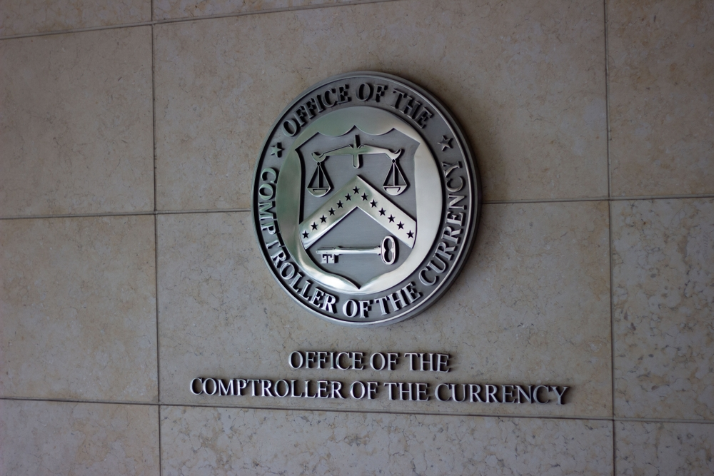 OCC headquarters representing the federal regulatory authority overseeing payment stablecoin issuers under the GENIUS Act framework.