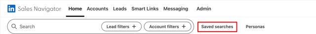 LinkedIn Sales Navigator top bar with the Saved searches link highlighted in red