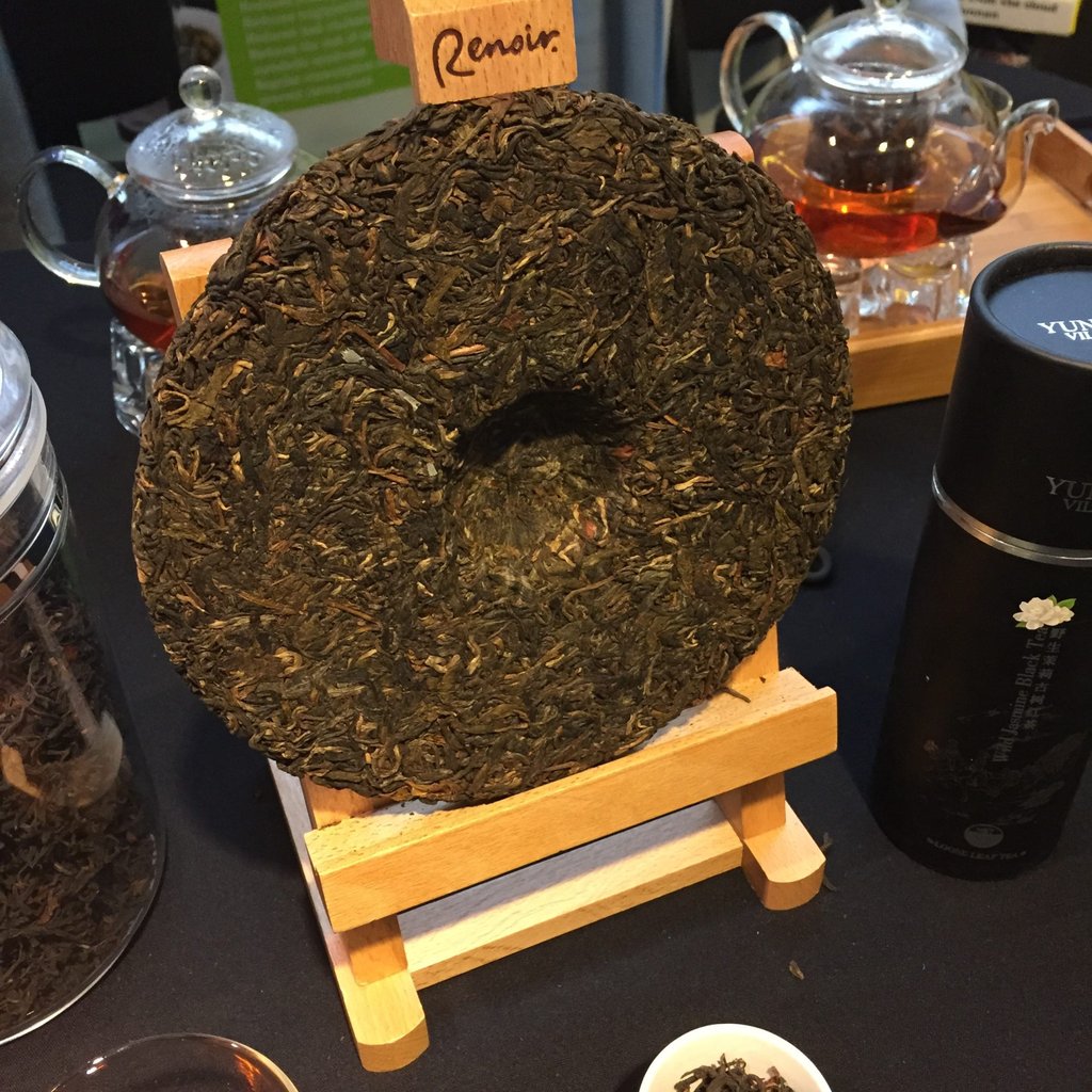 A finished puerh cake on display at a stall.