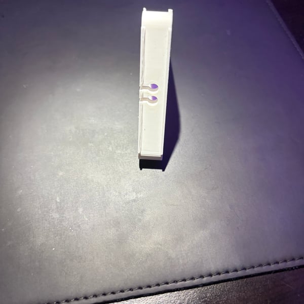 Image 4 of Triangular ear bud storage