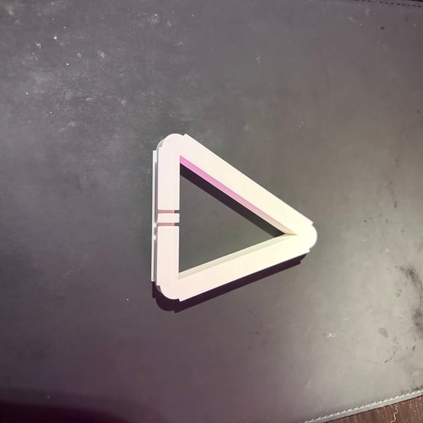 Image 2 of Triangular ear bud storage