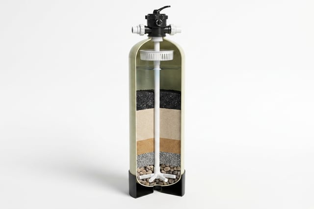 KKE W100 multimedia filter vessels installed on a skid frame, with multiport valves, PVC plumbing and storage tanks behind