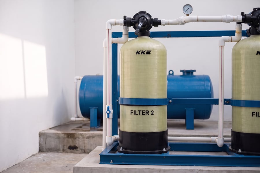 KKE W100 activated carbon filter installed on its skid frame, FRP vessels with multiport valves and pressure gauge