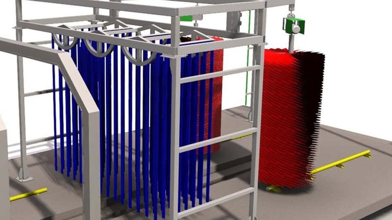 The brush stations of a KKE Z10 drive-through fleet car wash: blue vertical wrap brushes with a red rotating brush behind them