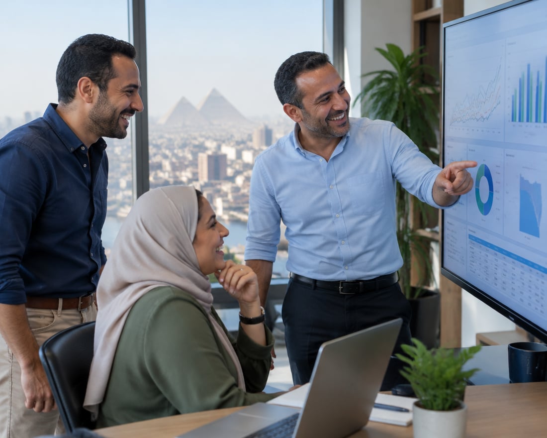 Egyptian professionals reviewing a dashboard in a Cairo office