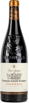 En glasflaska med Amadieu Domaine Grand Romane Gigondas Rouge, ett rött vin från Rhonedalen i Frankrike