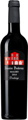 En glasflaska med Domaine Pouderoux, ett starkvin från Languedoc-Roussillon i Frankrike