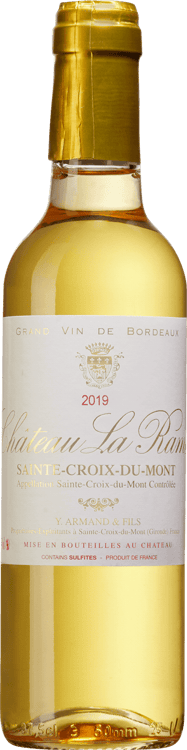 En glasflaska med Château La Rame, ett vitt vin från Bordeaux i Frankrike
