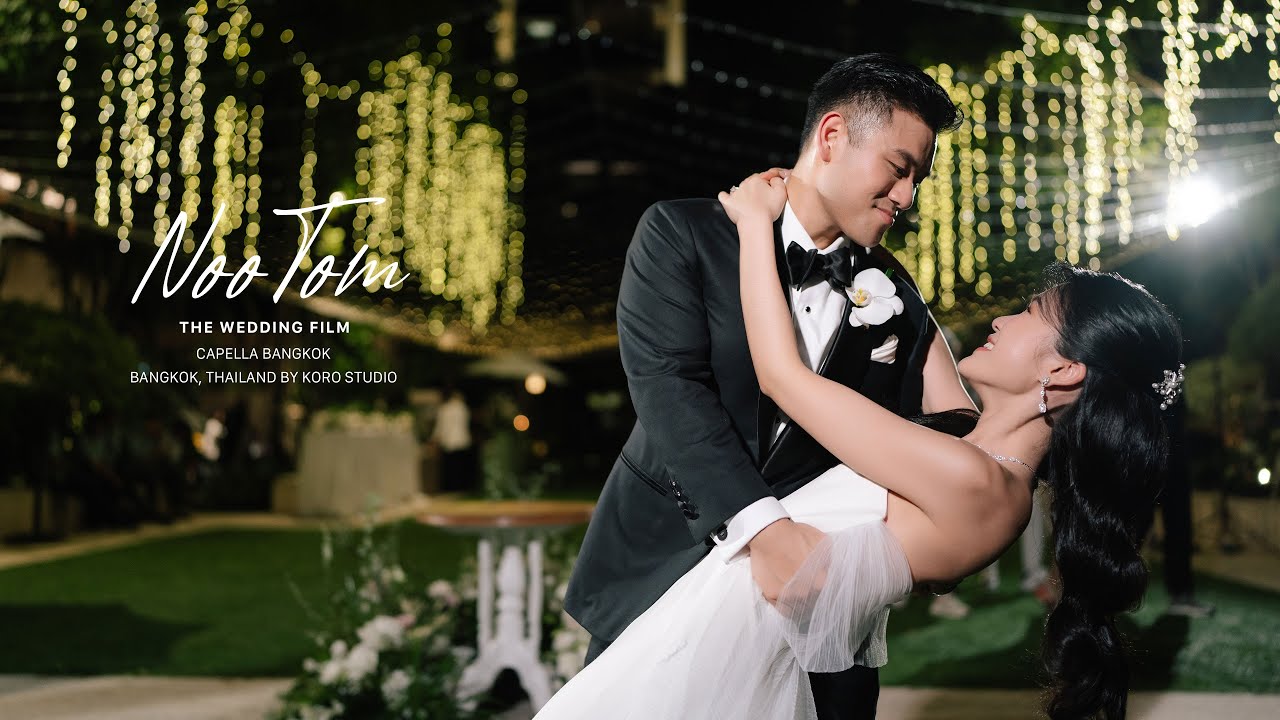 A cinematic shot of the wedding ceremony overlooking the Chao Phraya River at Capella Bangkok.