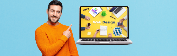 A man is pointing at a laptop with the word web design on it.