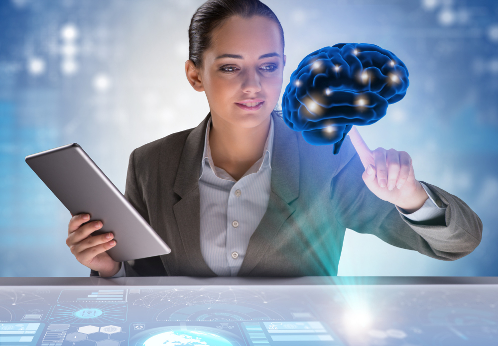 A woman holding a tablet with an image of a brain on it.