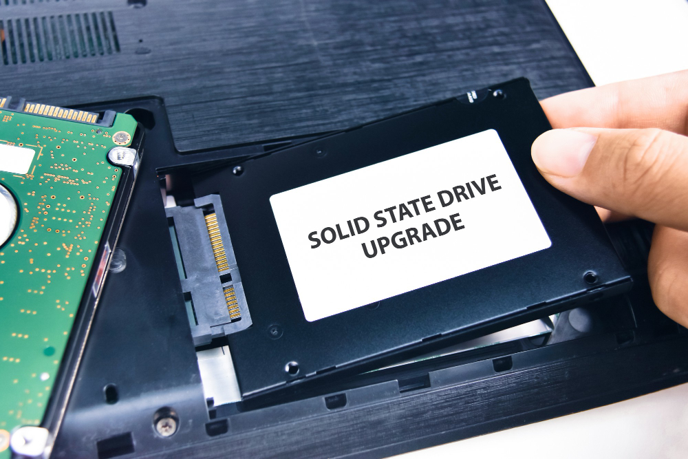 technician-installs-solid-state-drive-ssd-laptop-computer