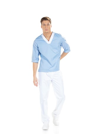 Man wearing a blue nurse's tunic with a white V-neck.