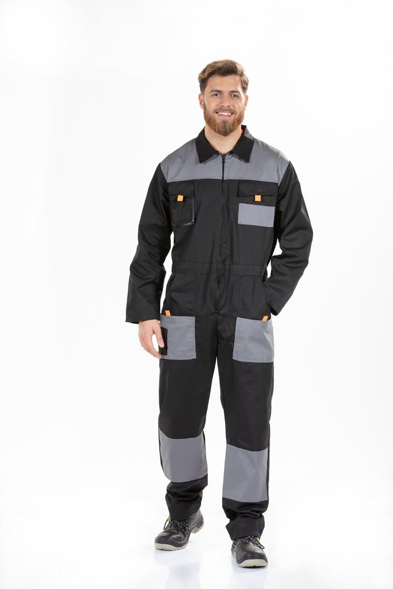 Worker wearing a black coverall with reinforced knees manufactured by Unifardas.
