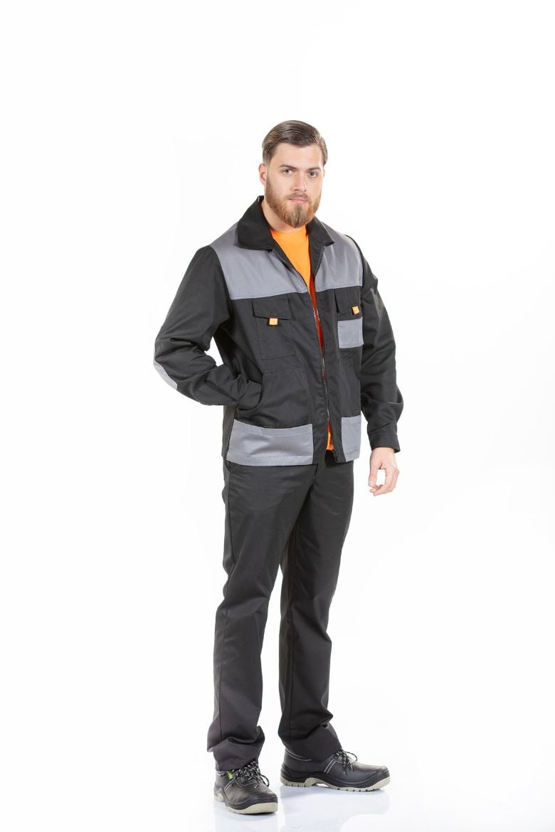 Man wearing an Industry Work Jacket in black with grey contrast, designed to be worn as a Work Uniform.