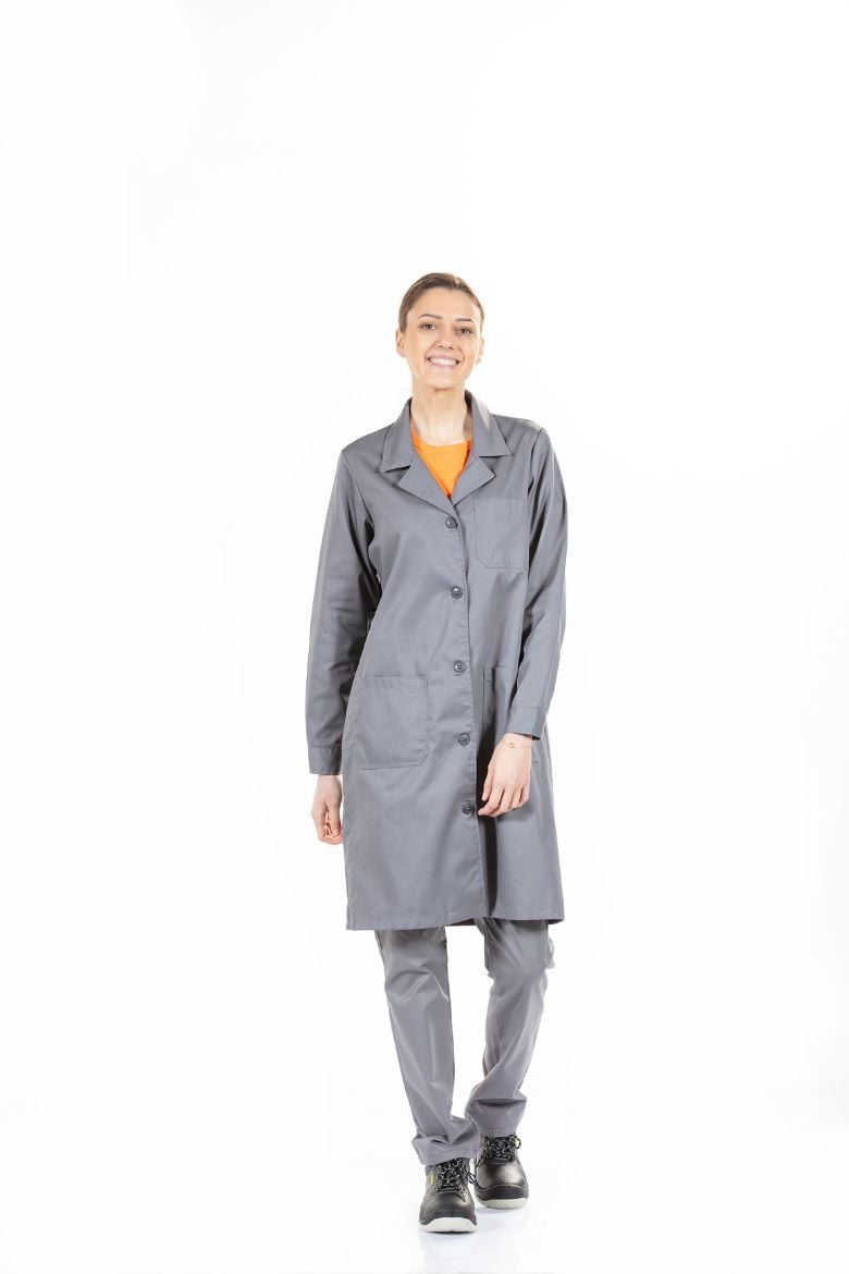 A woman wearing a Women's Gown as a work uniform.
