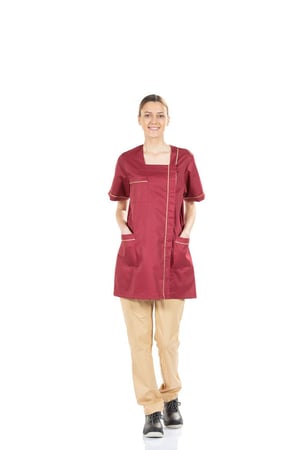 Lady wearing a red short-sleeved work coat with yellow contrasts