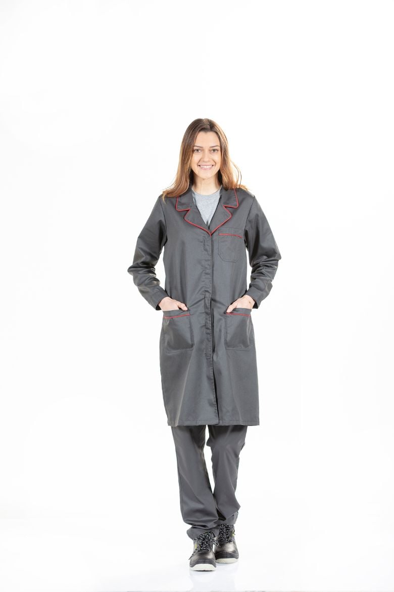 A lady wearing a Women's Uniform Jacket for work, manufactured by Unifardas.
