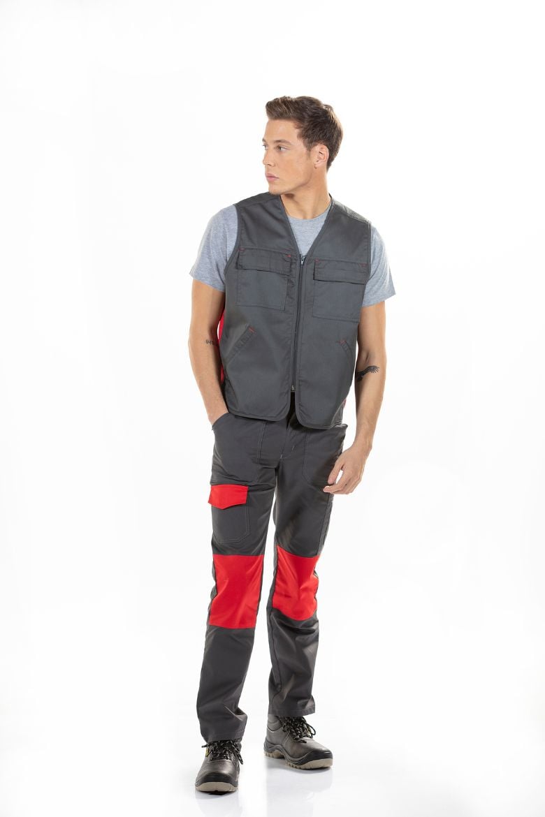 Man dressed in gray mechanic's pants with red contrasts for work uniform