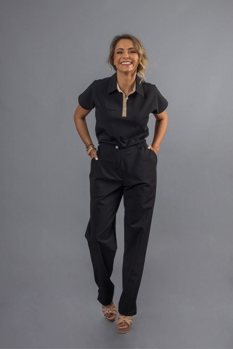 Health and Wellness professional wearing Women's Black Pants as part of a work uniform.