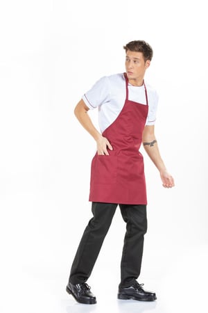 Hotel and restaurant worker wearing a men's custom apron for a work uniform manufactured by unifardas