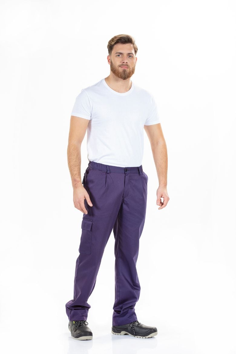 Worker in the industrial sector dressed in a white t-shirt and navy blue flame retardant pants to be used as a work uniform.