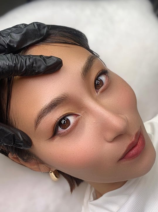Healed nano brows close-up with natural hair strokes