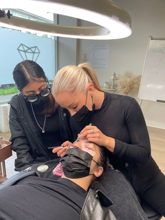Chela teaching permanent makeup technique to students