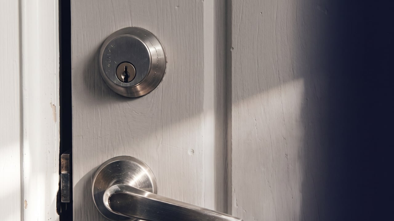 Lever door handle and deadbolt on a wooden exterior door
