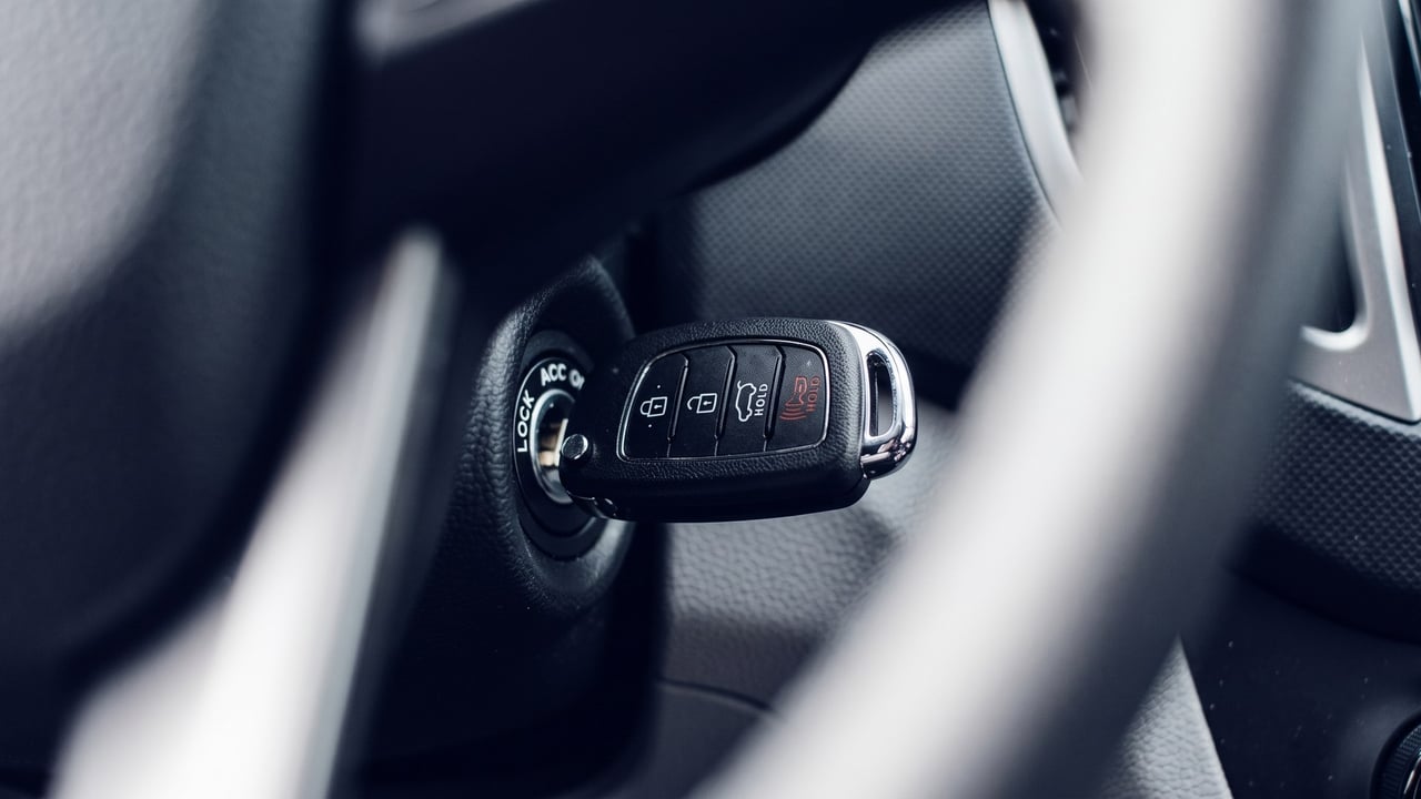 Transponder car key in the ignition beside the steering wheel