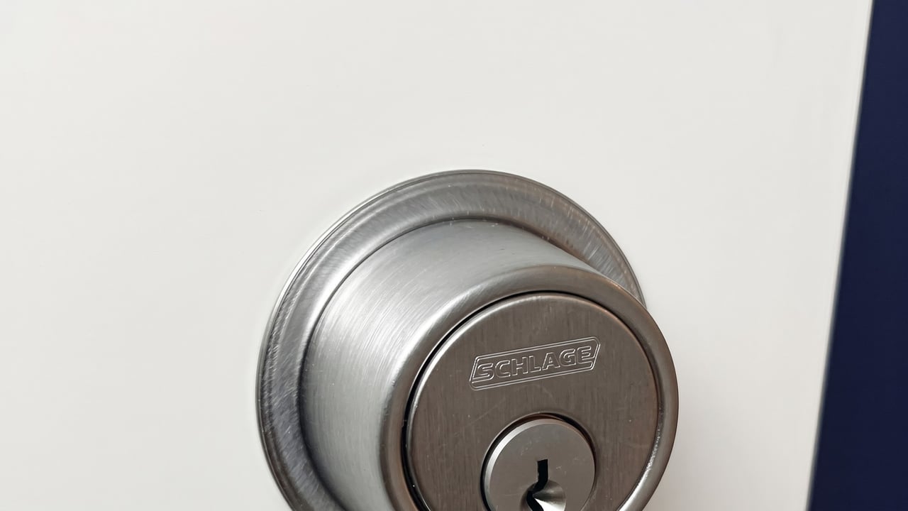 Newly installed deadbolt on a white exterior door