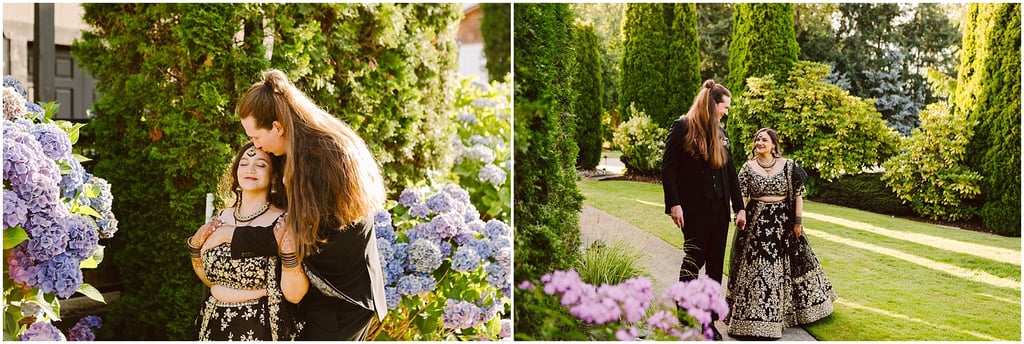 Couple in a garden with purple hydrangeas; the man leans to kiss the woman's head as she smiles.